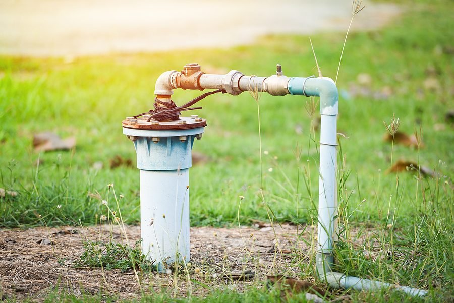 Pump system wellhead with PVC piping