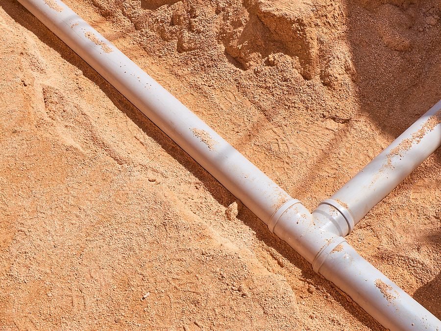 PVC sewer pipe junction in a sand bed