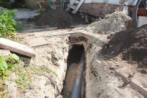 Trench dug for a main drain line